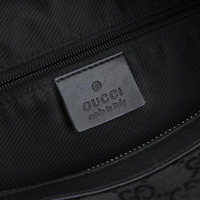 GUCCI, a canvas and leather bag.