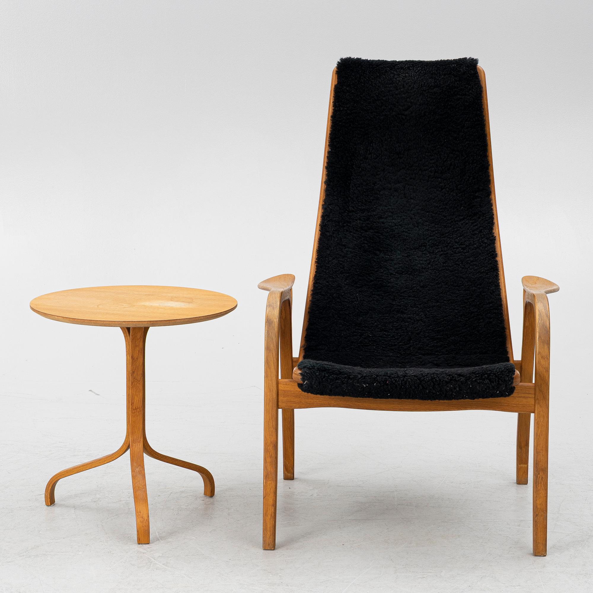 Yngve Ekström, a 'Lamino' armchair and sidetable, Swedese, Sweden, early 21st century.