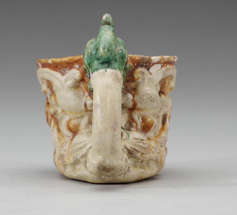 A green white and yellow glazed rhyton ewer, Tang dynasty (618-907).