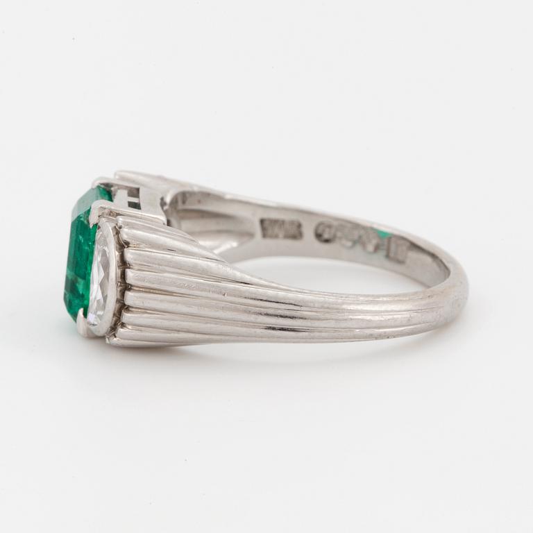 A WA Bolin platinum ring set with a faceted emerald ca 0.90 cts.