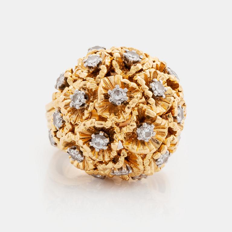 A WA Bolin ring in 18K gold set with round brilliant-cut diamonds.