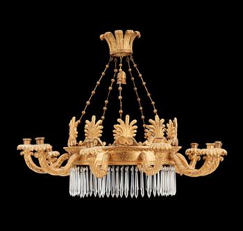 A German Empire 19th century ten-light gilt wood hanging lamp, possibly after K. F. Schinkel.