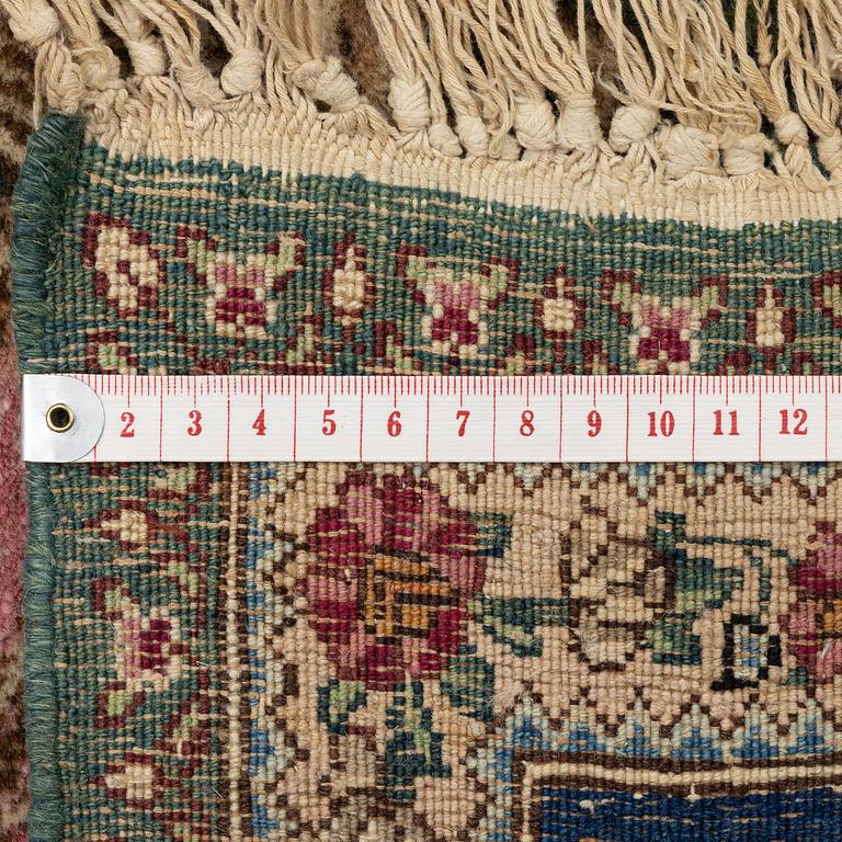 A semi-antique pictoral Kirman Lavar rug, Southeastern Persia (Iran), c. 236 x 156 cm.