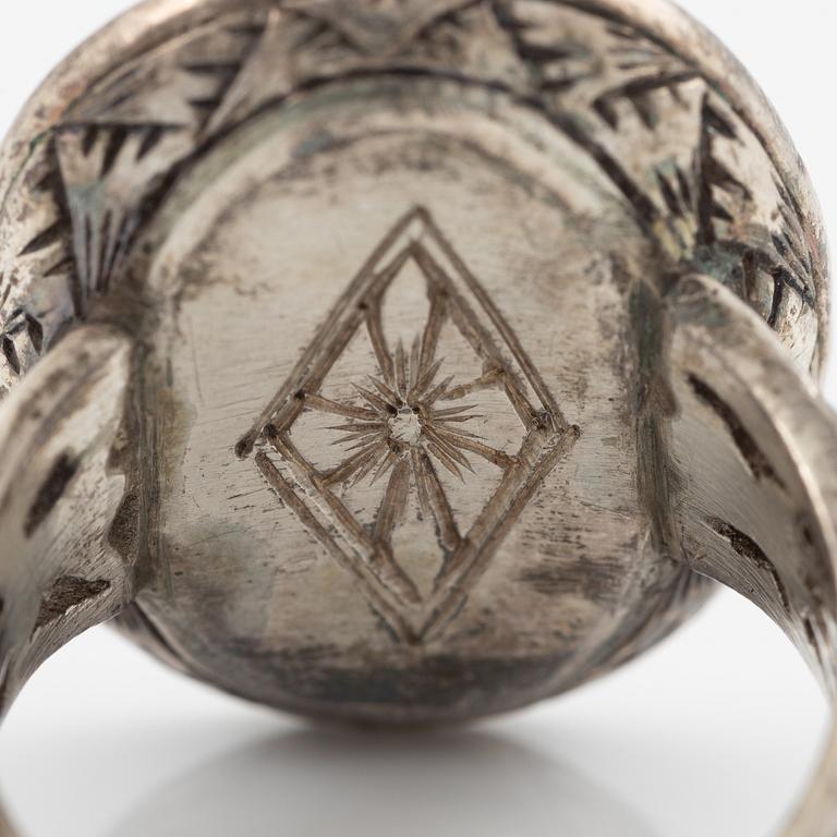 Silver ring with coral and marcasites and with black details.