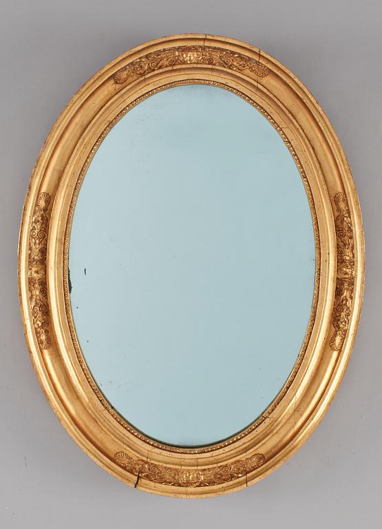 A Late empire mirror. 19th Century.