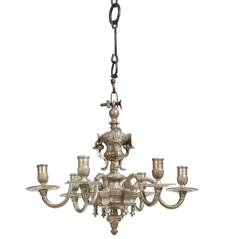 A Swedish silvered brass presumably late Baroque chandelier in the style of Jean Berain.