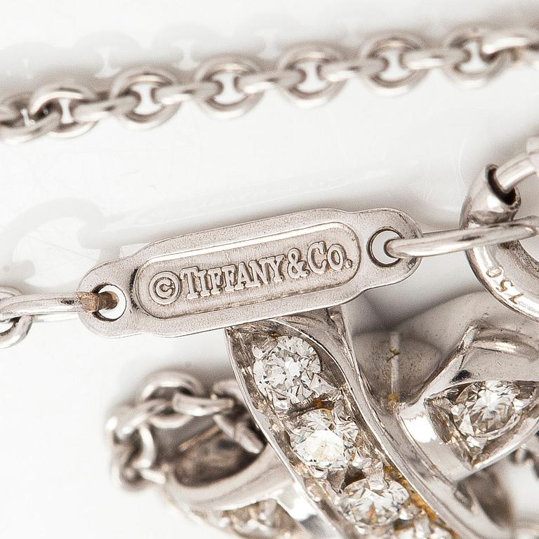 Tiffany & Co, kaulakoru "Cross Stitch", 18K valkokultaa ja timantteja.