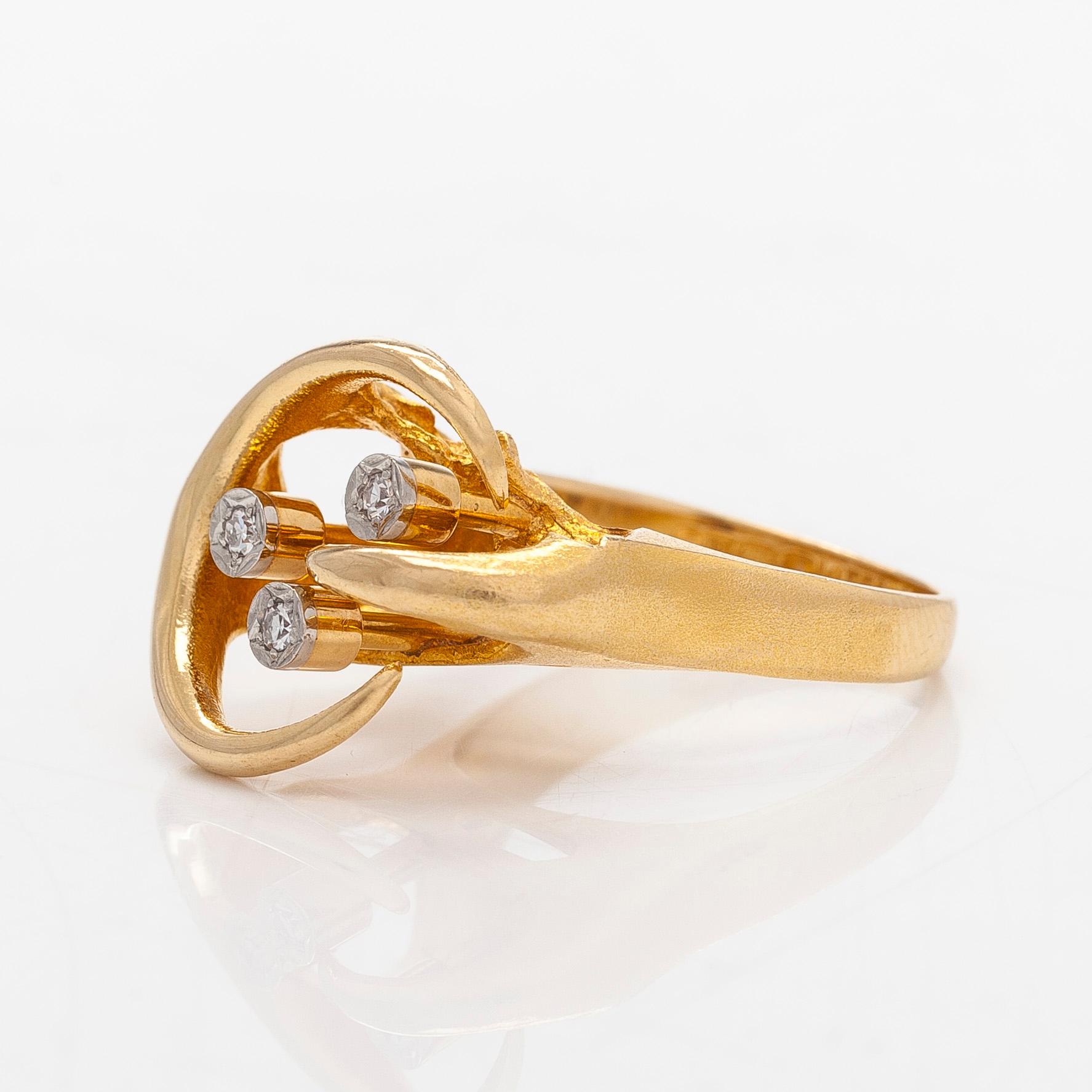 Björn Weckström, An 18K gold ring, with octagon-cut diamonds totalling ca 0.06 ct according to engraving, Lapponia 1975.