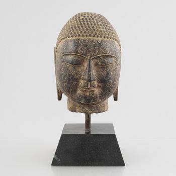 A Buddha's head, stone. Ming style.