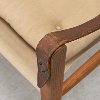 Kaare Klint, A pair of 'Safari' armchairs, Rud. Rasmussen's Snedkerier, Denmark, second half of the 20th century.
