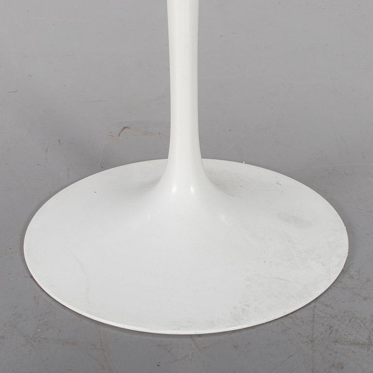 AN EERO SAARINEN "TULIP" TABLE BY KNOLL INTERNATIONAL.