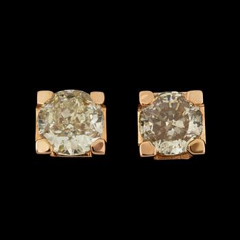 1038. A pair of Fancy Brownish Greenish Yellow diamond earrings. 1.14 and 1.25 cts.