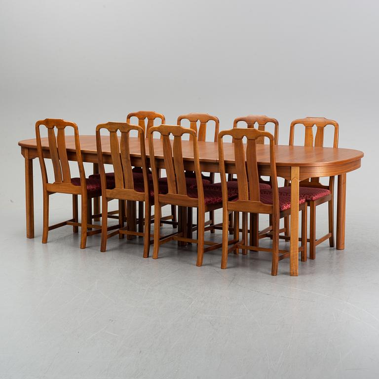 An 'Ambassadör' dining table with eight chairs by Carl Malmsten, second half of the 20th Century.