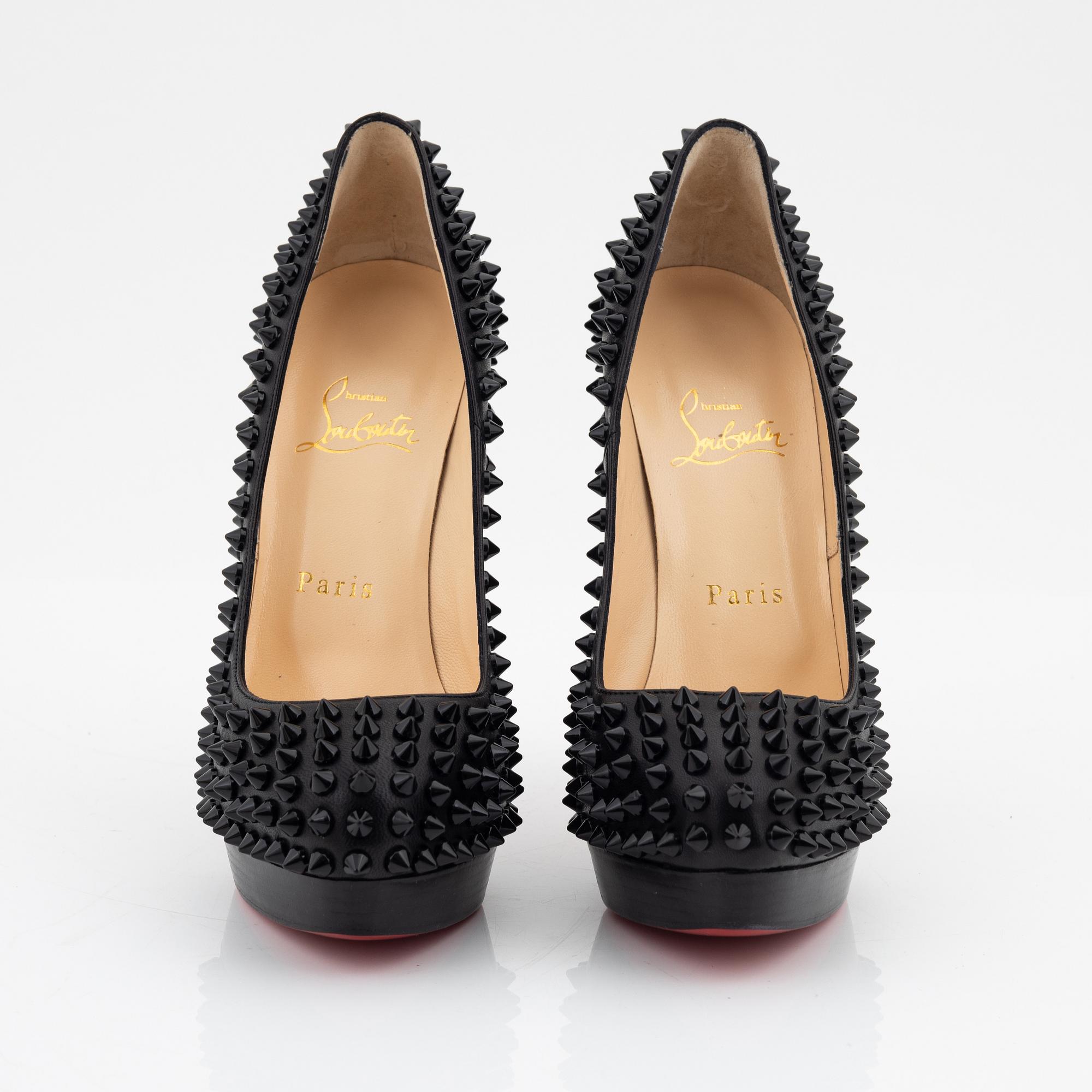 Christian Louboutin, a pair of black leather and studs pumps