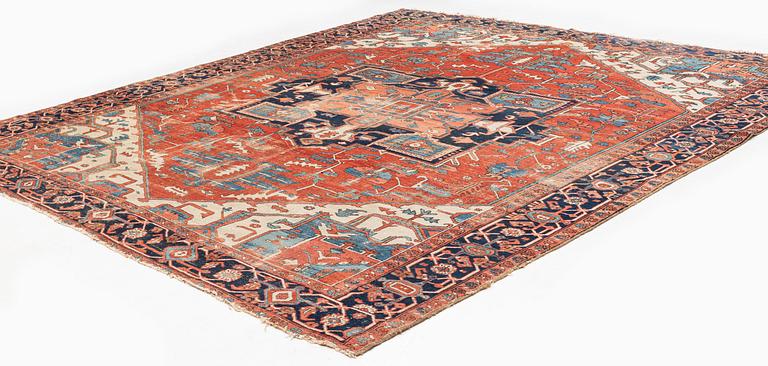 An antique Heriz carpet, ca 350 x 317 cm.