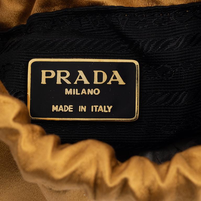 Prada, a satin bag.