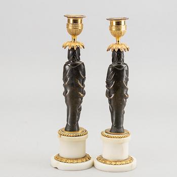 A pair of Louis XVI 18/19 century candlesticks.