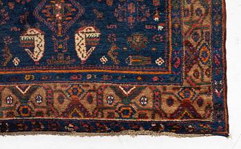 A semi-antique Northwest Persian runner, c. 388 x 94 cm.