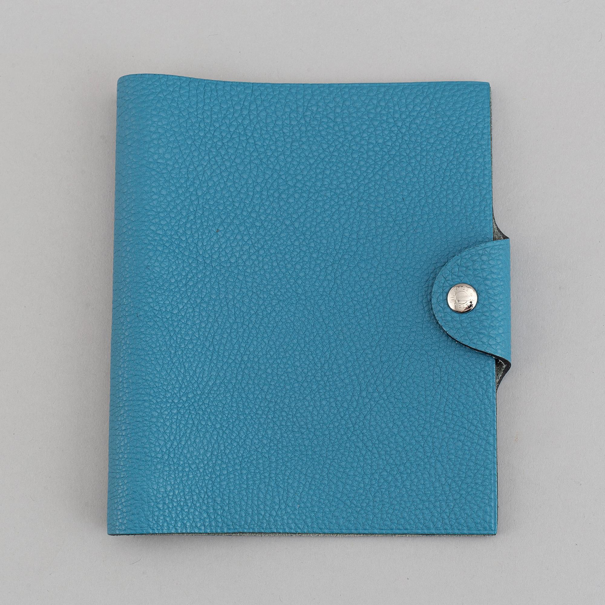 Hermès, a blue leather notebook with two scripple pads.