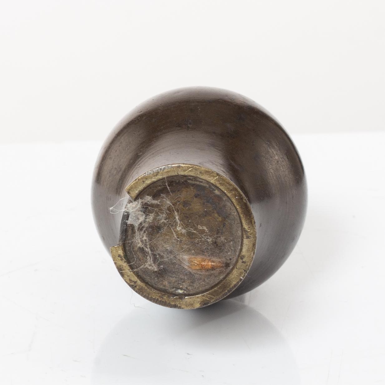 A Chinese bronze vase, joss stick holder and a bamboo brush pot, Qing dynasty.