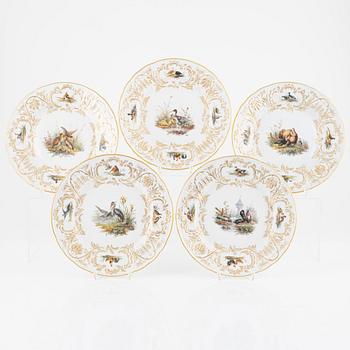 A set of five Meissen porcelain games plates, late 19th to early 20th century.