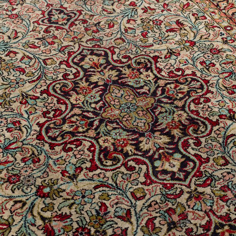 A silk Qum rug, around 114 x 80 cm.