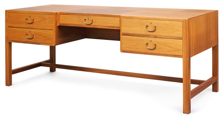 A Josef Frank walnut desk by Svensk Tenn, the front with five drawers, the backwith a bookshelf.