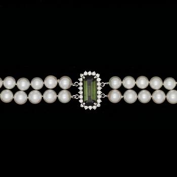 1342. A two strand cultured pearl and diamond clasp necklace.