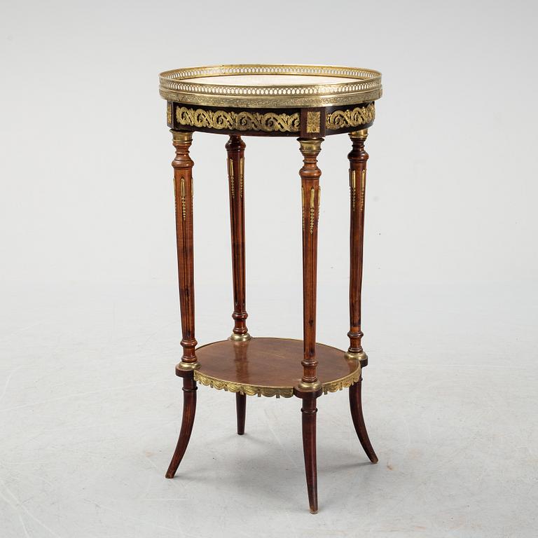 A French Louis XVI-style table, first half of the 20th century.