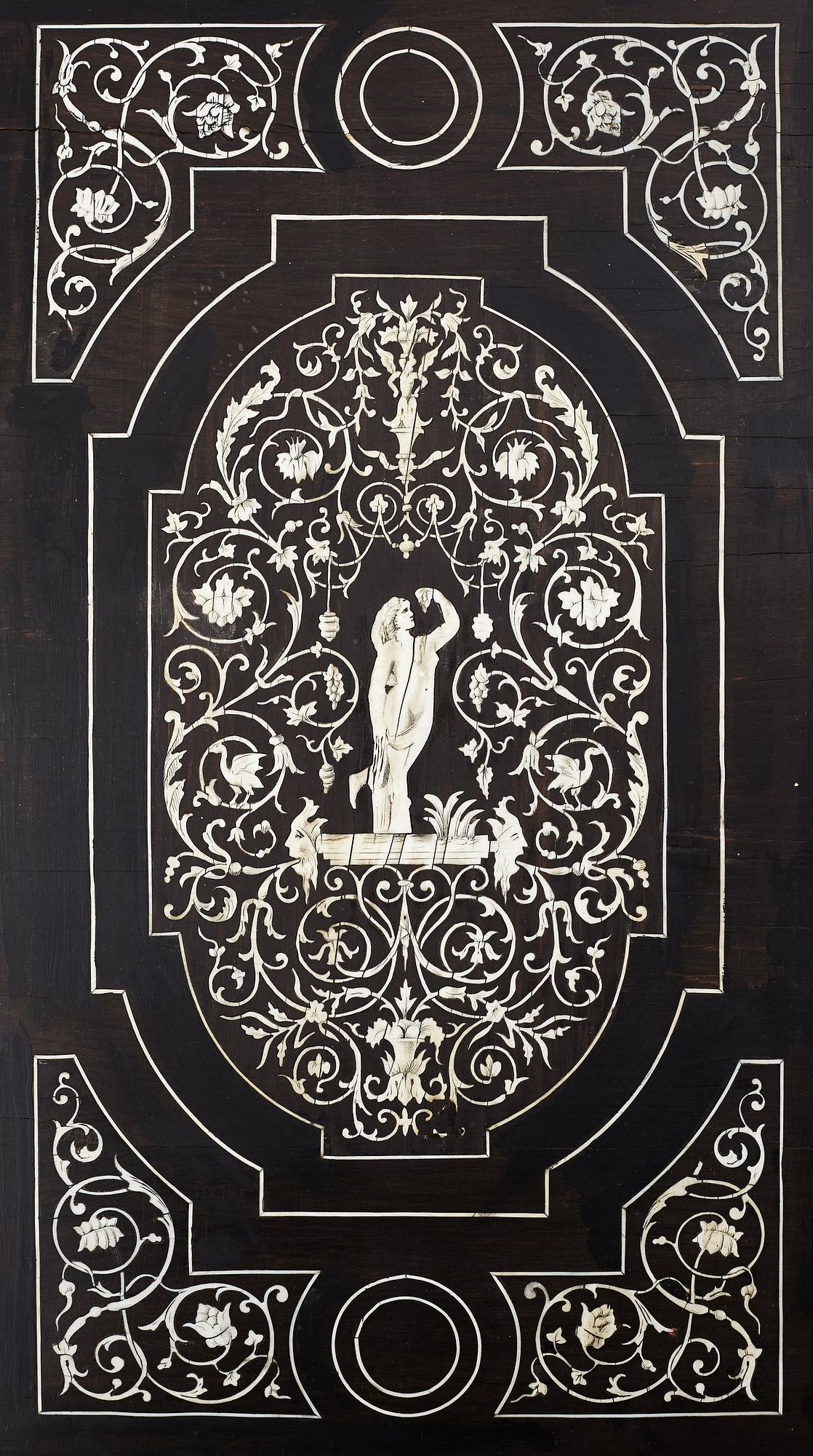 A Renaissance-style ebony, ebonized and ivory-inlaid library table, late 19th century, presumably Germany.