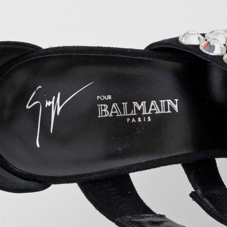 BALMAIN, a pair of black suede sandals with decorative embellishment.