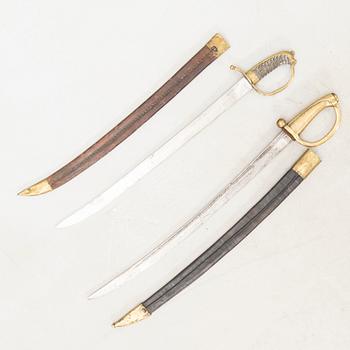 To cutlasses, 19th century, with scabbards.