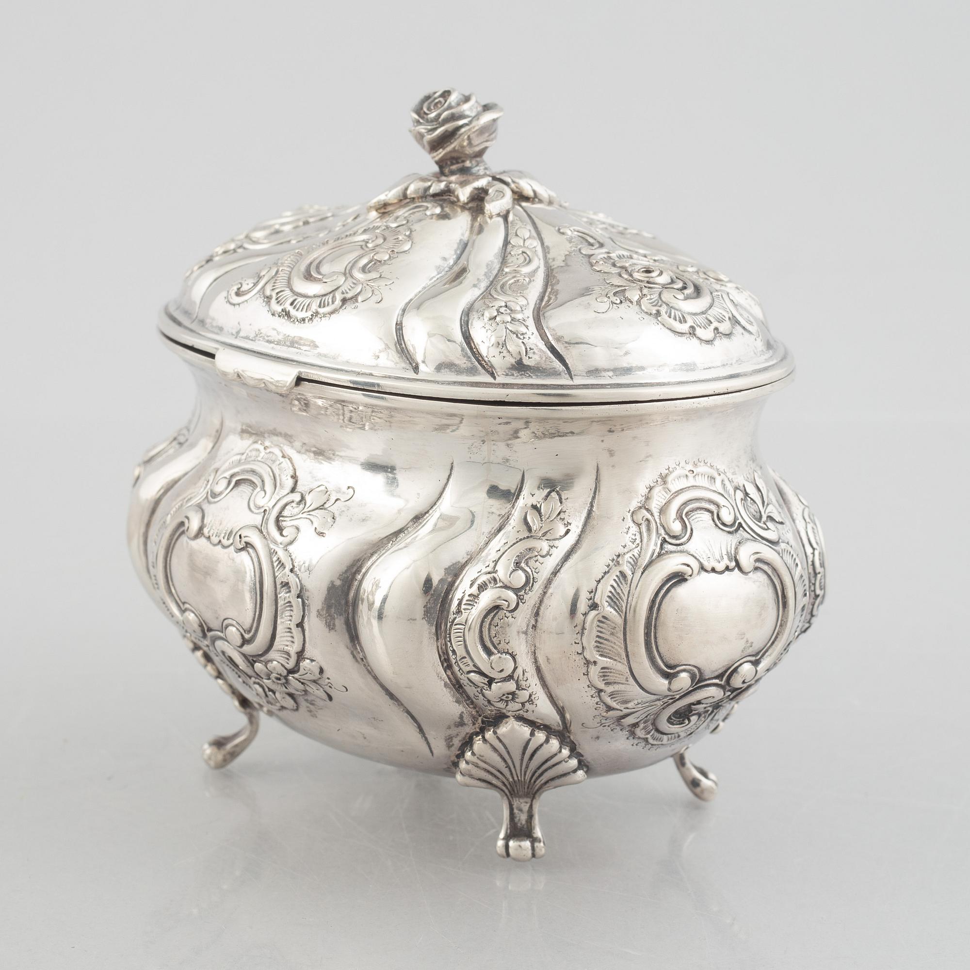 A Rococo-style silver coffee pot, creamer and sugar bowl, 20th Century.