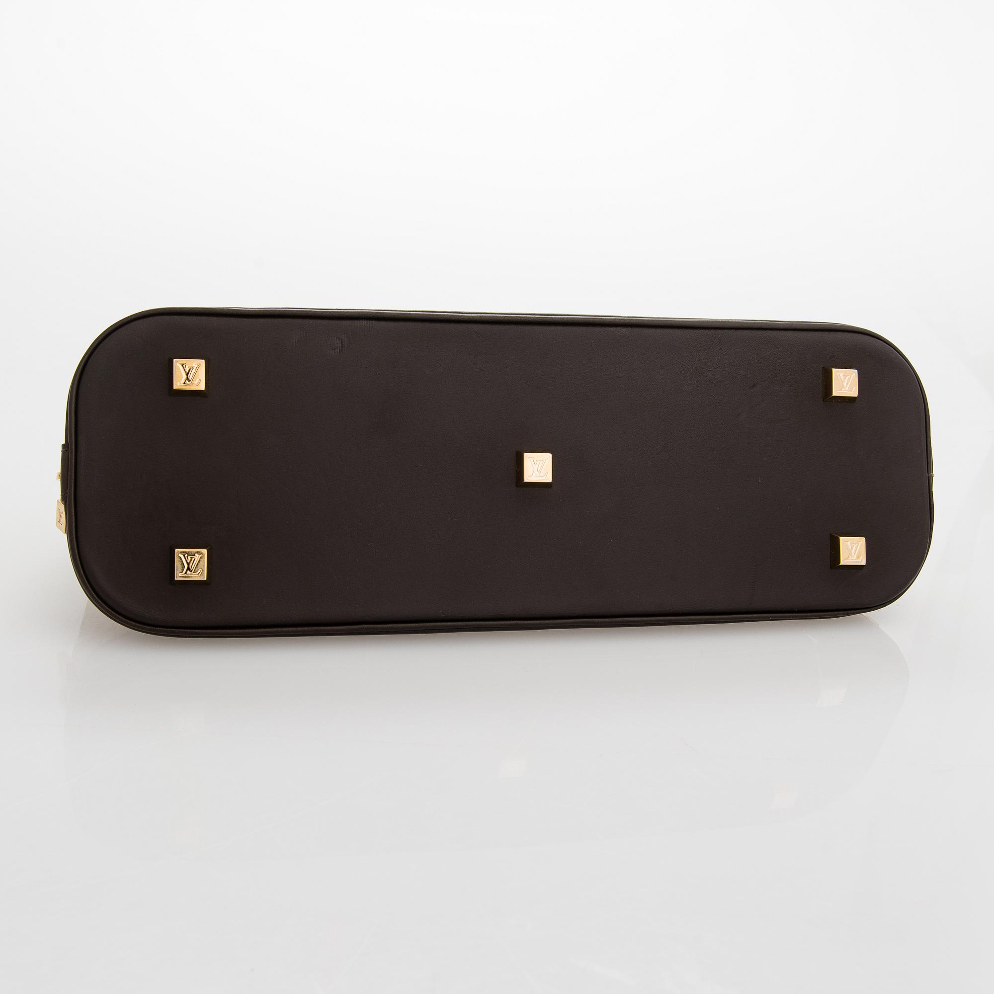 Louis Vuitton, a 'Monogram Mini Lin Alma Long Handbag'.