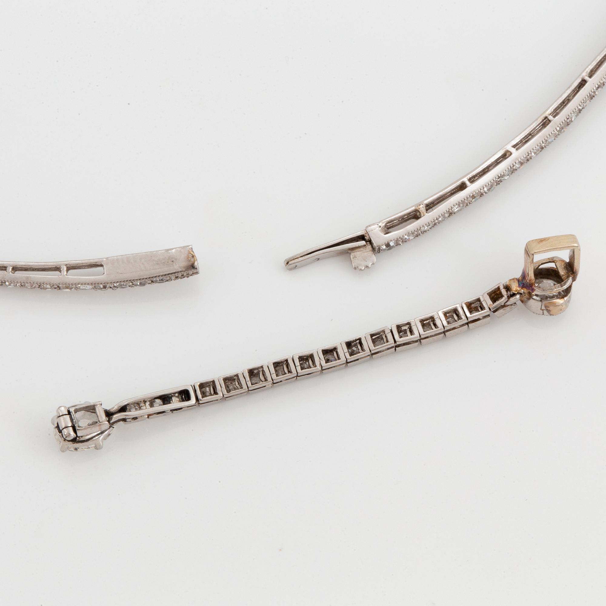 A platinum and 18K gold necklace and pendant.