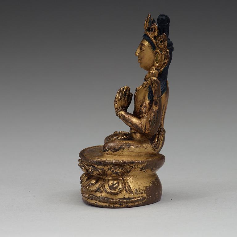 A Tibetan gilt copper alloy figure of Boddhisattva Shadakshari Lokeshvara, 16th Century or older.