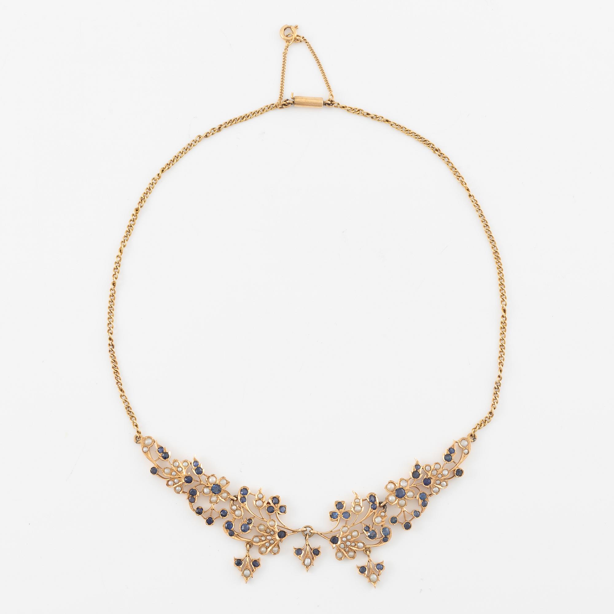 A 14K gold necklace with sapphires and pearls.