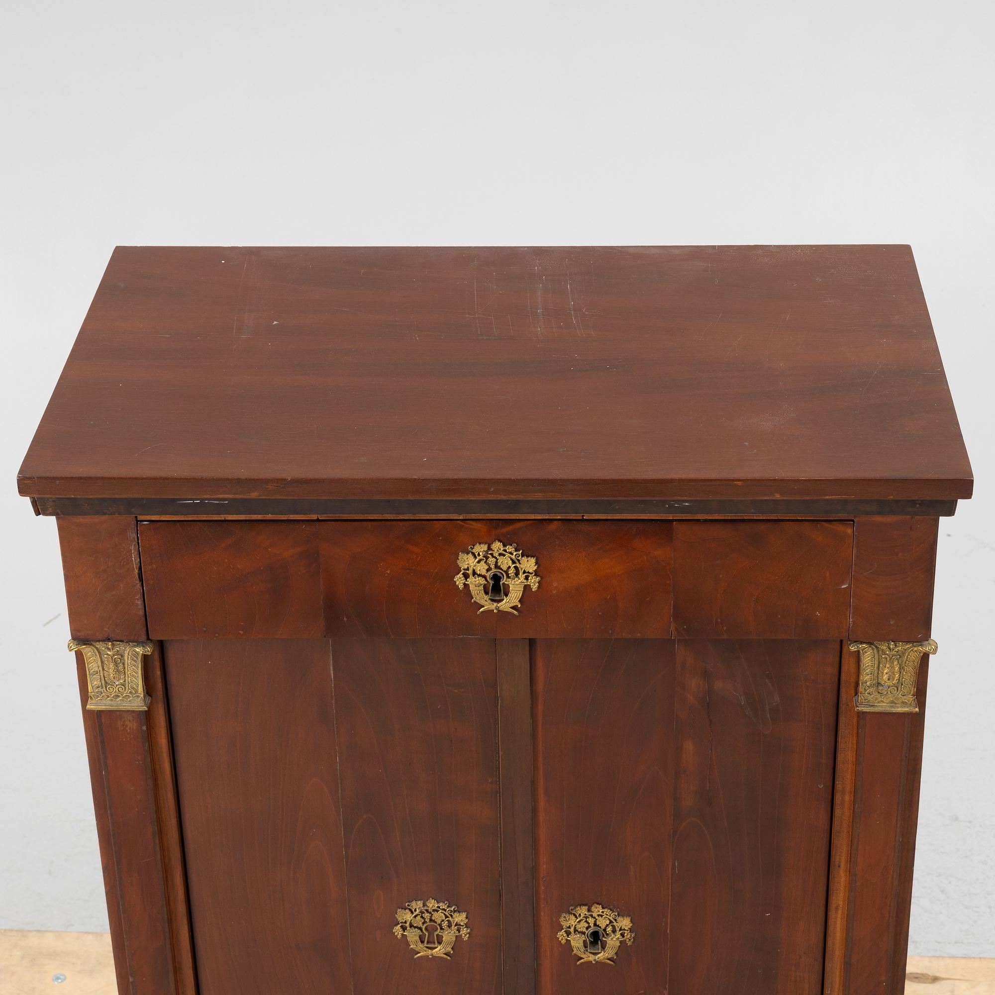 An Empire cabinet, first half of the 20th Century.