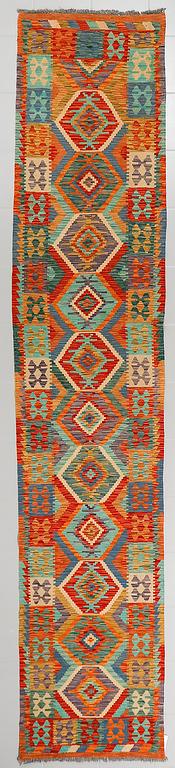 A kelim runner, ca 398 x 76 cm.