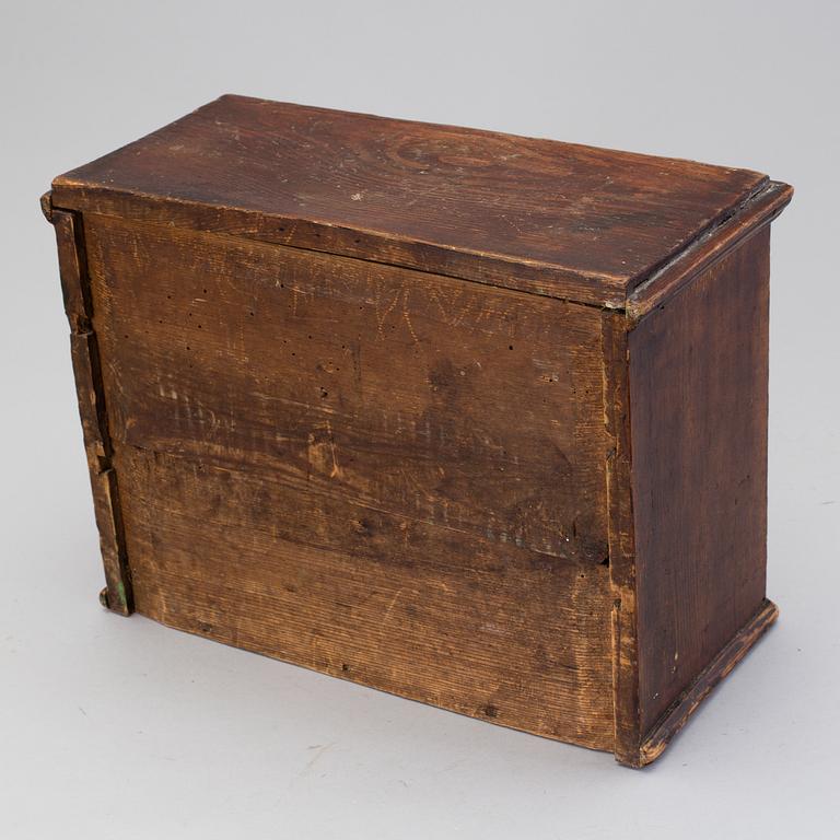 A 19th century miniature chest of drawers.