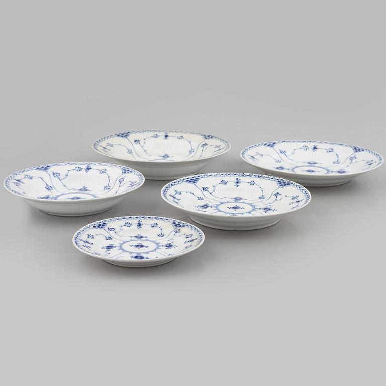 Royal Copenhagen, a 116-piece 'blue Fluted' porcelain dinner and coffee service, half lace, Denmark, mostly 1923-34.