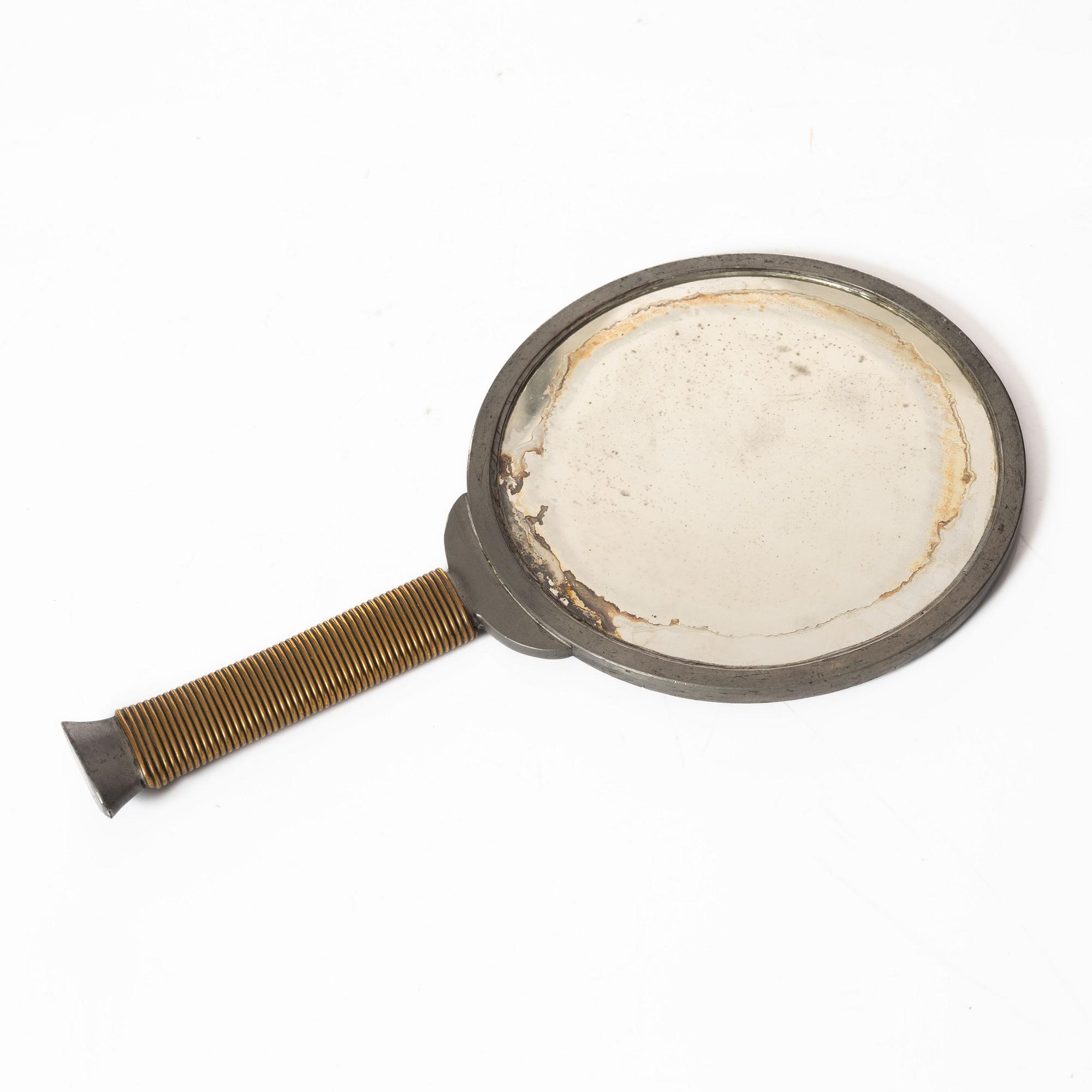 Estrid Ericson & Björn Trägårdh, a pewter and brass hand mirror model A 1444, Svenskt Tenn, Sweden 1930s-40s.