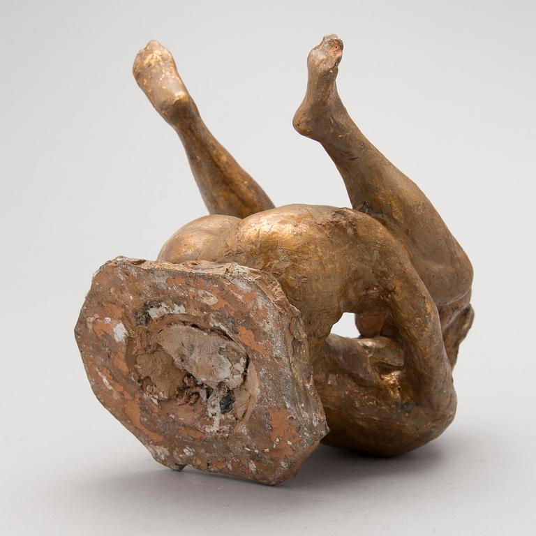 A gilt terracotta sculpture signed Matti Haupt.