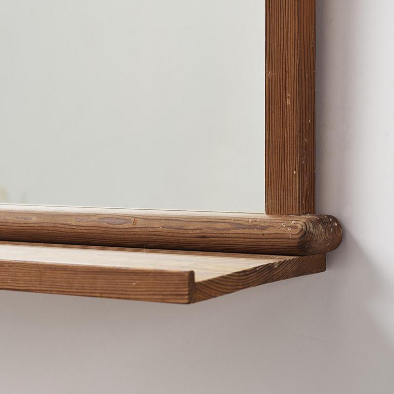 Axel Einar Hjorth, a stained pine "Sport" wall mirror with a shelf, Nordiska Kompaniet, Sweden, 1930s.