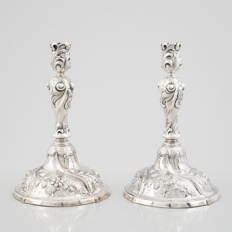 A pair of Rococo style sterling silver candelsticks, Swedish import mark.