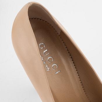 Gucci, a pair of leathermshoes, Italian size 37.