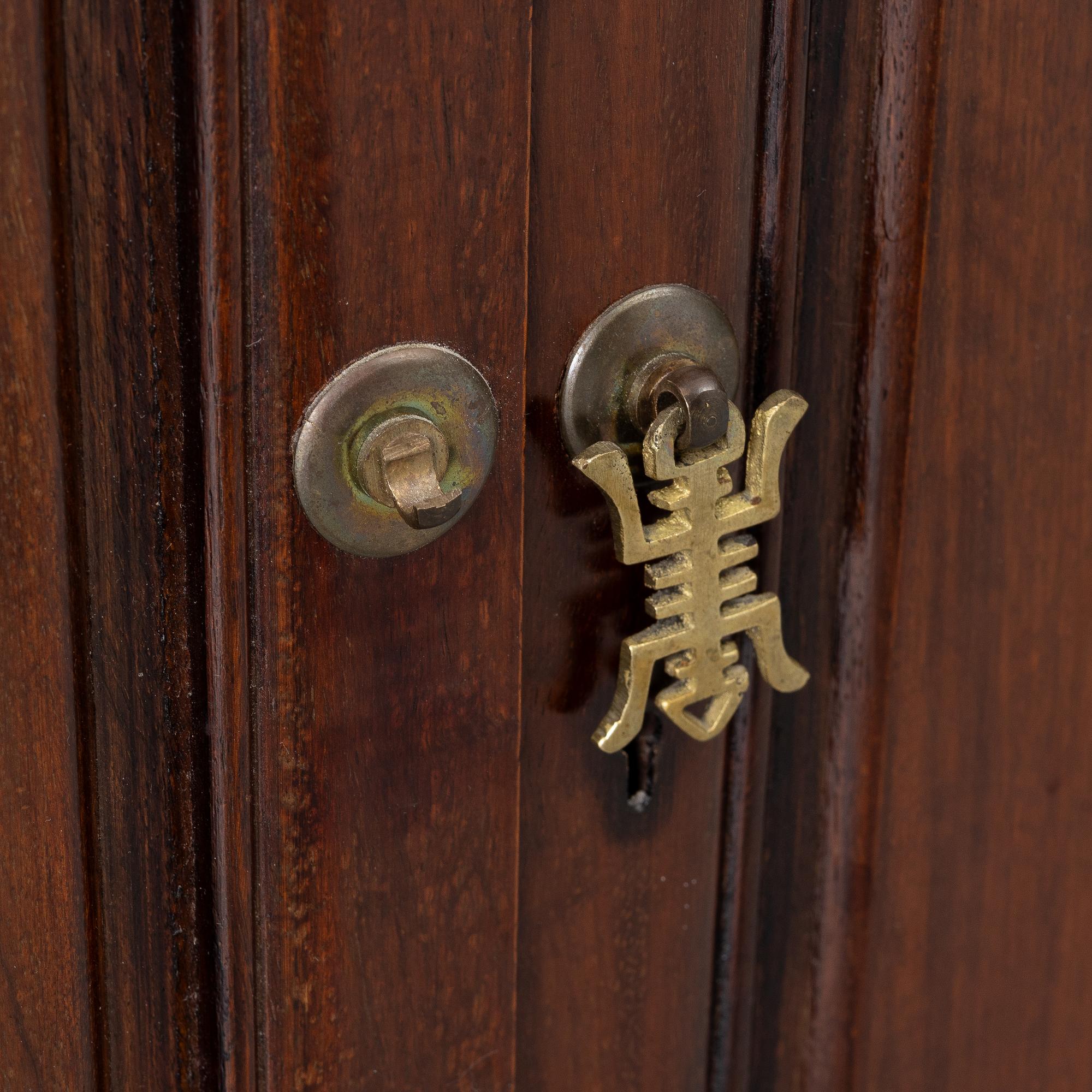 A Chinese display cabinet, wood and glass, later part of the 20th century.