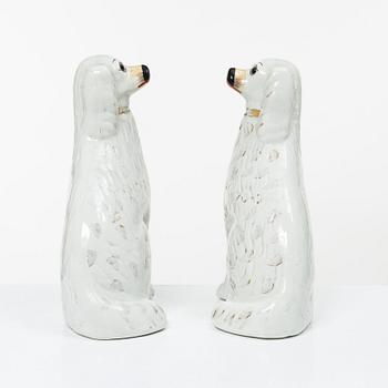 A pair of creamware glass-eyed Spaniels, Staffordshire, England, Victorian (1837-1901).