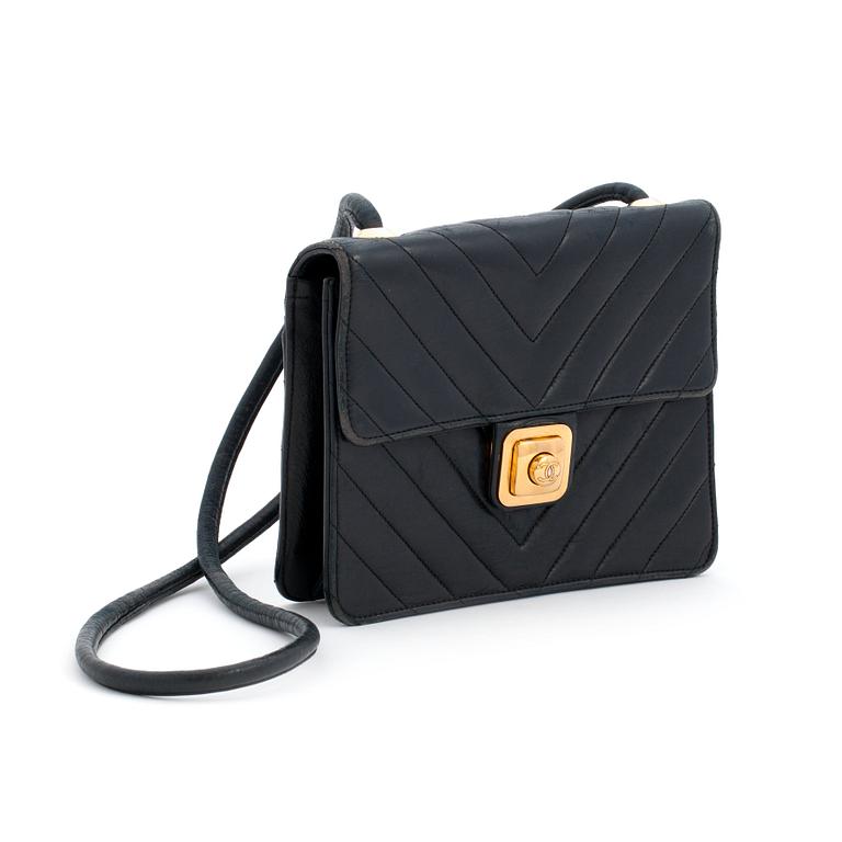 CAHNEL a black leather crossbody bag.