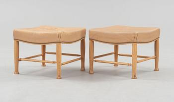 A pair of Josef Frank mahogany and beige leather stools, Svenskt Tenn, model 902.